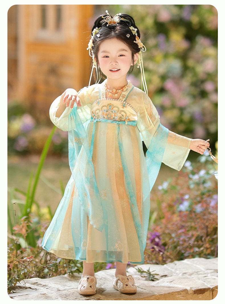 Child in traditional outfit with floral background