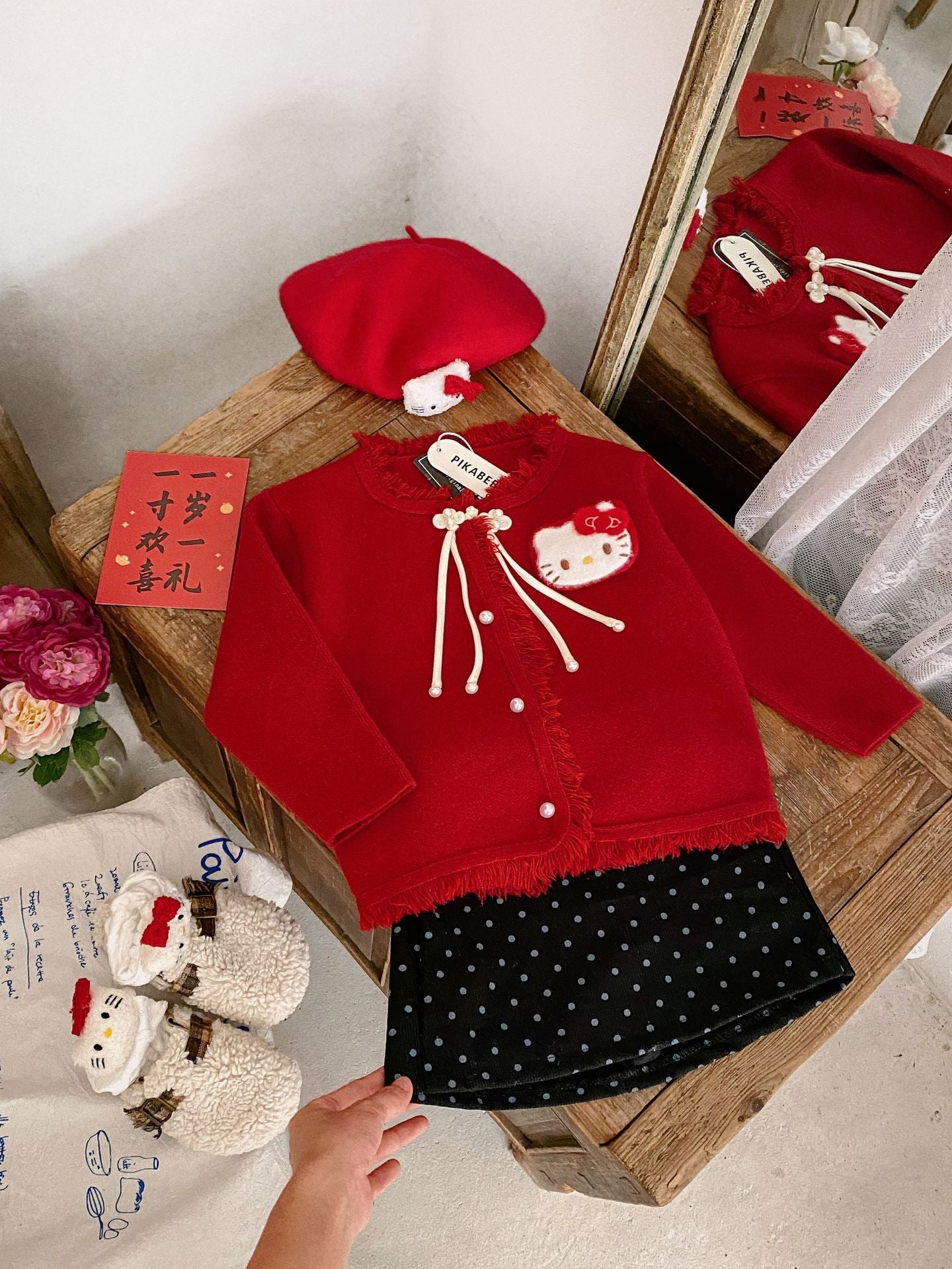 Hello Kitty Cozy Fringe Hooded Sweater in Red