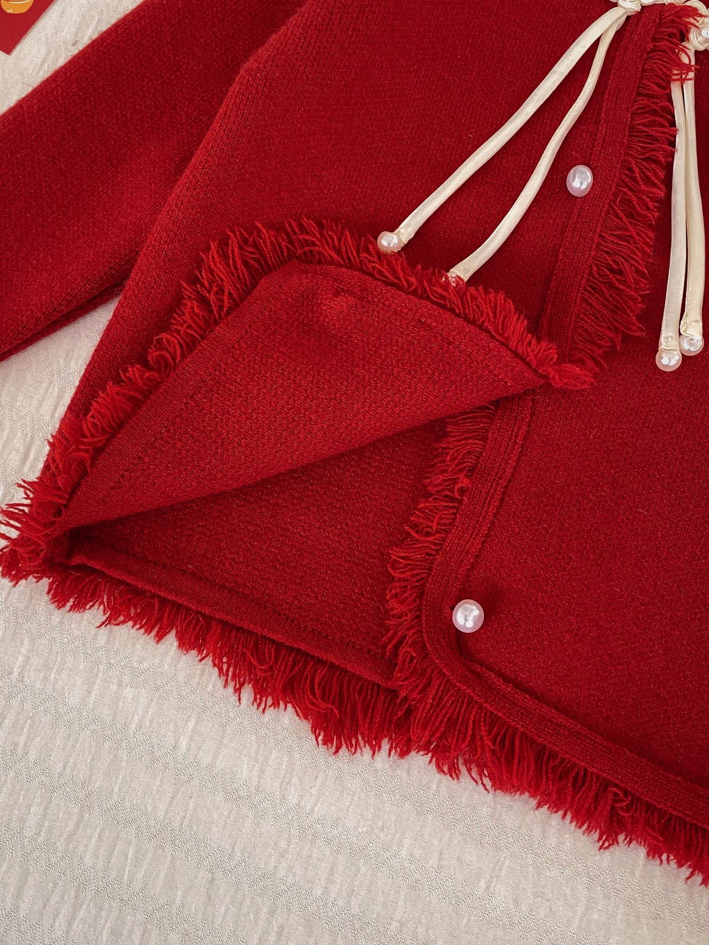 Hello Kitty Cozy Fringe Hooded Sweater in Red