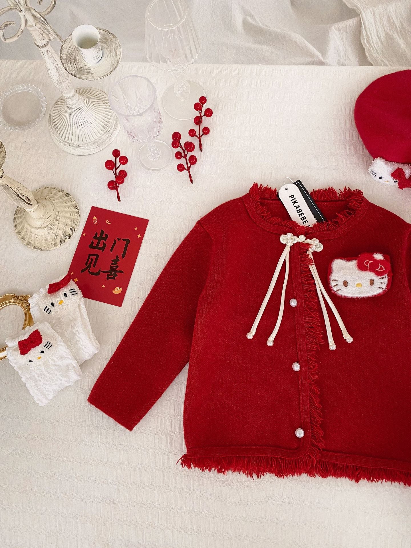 Hello Kitty Cozy Fringe Hooded Sweater in Red