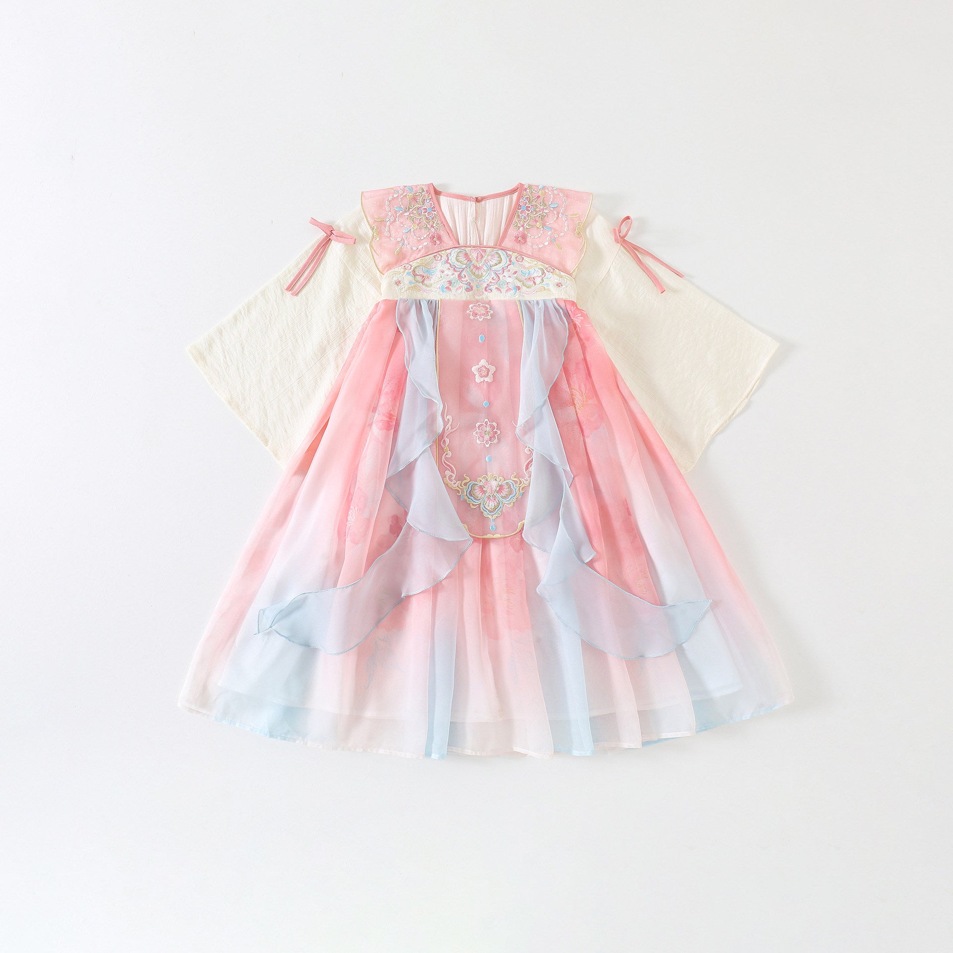 Pink and white dress with decorative elements on a light gray background